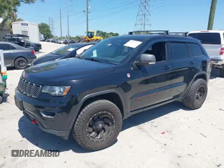 2017 Jeep Grand Cherokee Trailhawk with VIN 1C4RJFLG3HC836072, listed as a IAAI auction lot 42073775 with 139,374 mi miles and . Bid and sale history available at DreamBid. Image 2.