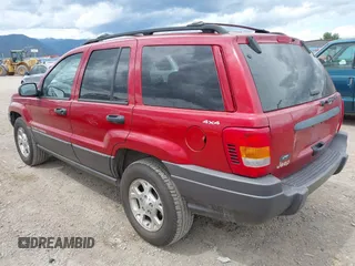 2001 Jeep Grand Cherokee Laredo with VIN 1J4GW48N51C732011, listed as a IAAI auction lot 42194017 with 195,716 mi miles and . Bid and sale history available at DreamBid. Image 3.
