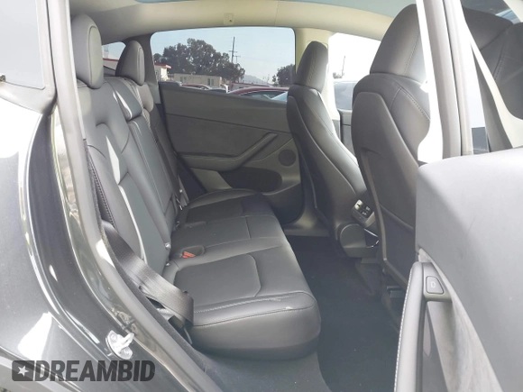 2025 Tesla Model Y Long Range with VIN 7SAYGDED6SF229498, listed as a IAAI auction lot 41086718 with 509 mi miles and . Bid and sale history available at DreamBid. Image 8.