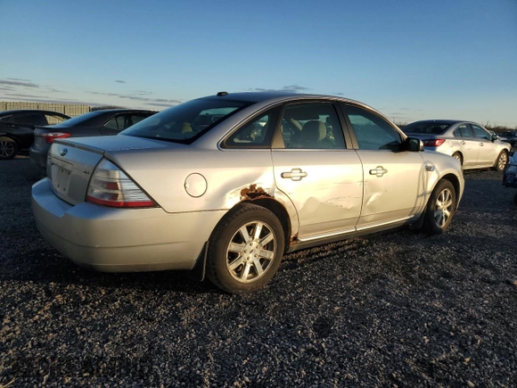 2009 Ford Taurus SEL with VIN 1FAHP24W79G103208, listed as a Copart auction lot 77621914 with 231,659 mi miles and Salvage Title. Bid and sale history available at carsss.com. Image 3.