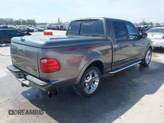2002 Ford F-150 Harley Davidson with VIN 1FTRW07392KE11409, listed as a IAAI auction lot 41877998 with 148,476 mi miles. Bid and sale history available at carsss.com. Image 4.