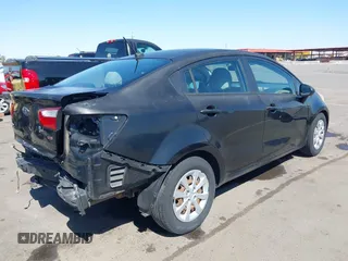 2014 Kia Rio LX with VIN KNADM4A39E6364490, listed as a IAAI auction lot 42128702 with 130,981 mi miles and . Bid and sale history available at DreamBid. Image 4.