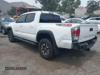 2023 Toyota Tacoma SR with VIN 3TMCZ5AN1PM556299, listed as a IAAI auction lot 42344160 with 42,338 mi miles and . Bid and sale history available at DreamBid. Image 3.