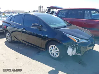 2021 Toyota Prius L Eco with VIN JTDKAMFU3M3148574, listed as a IAAI auction lot 41624303 with 89,747 mi miles. Bid and sale history available at carsss.com. Image 1.