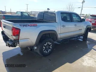 2018 Toyota Tacoma SR with VIN 3TMCZ5AN3JM170037, listed as a IAAI auction lot 42565385 with 157,450 mi miles and . Bid and sale history available at DreamBid. Image 4.