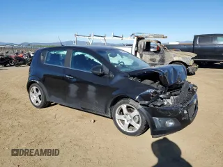 2012 Chevrolet Sonic LTZ z VIN 1G1JE6SH5C4195594, wystawiony jako Copart lot #88336435 z przebiegiem 105 112 mil mil oraz Szkoda całkowita • Salvage title. Historia ofert i sprzedaży dostępna na DreamBid. Obrazek 4.