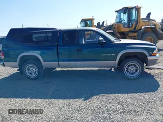 1999 Dodge Dakota SLT with VIN 1B7GG22Y2XS157214, listed as a IAAI auction lot 39776504 with 144,928 mi miles and . Bid and sale history available at carsss.com. Image 13.