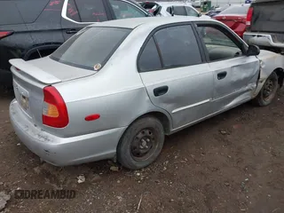 2001 Hyundai Accent GL with VIN KMHCG45C61U156696, listed as a IAAI auction lot 41643757 with 336,344 mi miles. Bid and sale history available at carsss.com. Image 4.