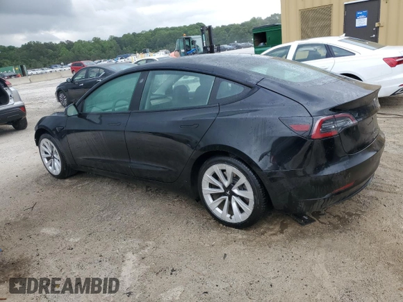 2022 Tesla Model 3 with VIN 5YJ3E1EA0NF372095, listed as a Copart auction lot 54958215 with 148,441 mi miles and Clean Title. Bid and sale history available at DreamBid. Image 2.