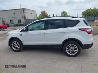 2018 Ford Escape SE z VIN 1FMCU9GDXJUC99453, wystawiony jako IAAI lot #42195202 z przebiegiem 191 840 mil mil oraz . Historia ofert i sprzedaży dostępna na DreamBid. Obrazek 14.