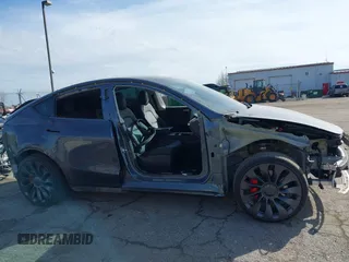 2023 Tesla Model Y Performance with VIN 7SAYGDEF7PF590750, listed as a IAAI auction lot 41694002 with Not Provided miles and . Bid and sale history available at DreamBid. Image 13.