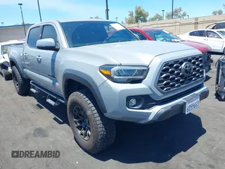 2021 Toyota Tacoma SR5 with VIN 3TMDZ5BN2MM116770, listed as a IAAI auction lot 42629104 with 47,673 mi miles and . Bid and sale history available at DreamBid. Image 1.