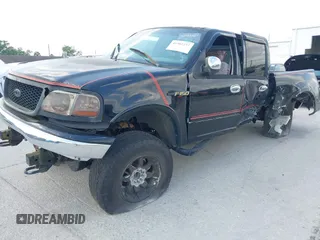 2003 Ford F-150 XLT z VIN 1FTRW08L73KA58913, wystawiony jako IAAI lot #41907277 z przebiegiem 147 294 mil mil oraz . Historia ofert i sprzedaży dostępna na DreamBid. Obrazek 20.
