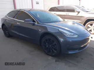 2018 Tesla Model 3 Long Range Battery with VIN 5YJ3E1EA7JF163401, listed as a IAAI auction lot 41829681 with 90,065 mi miles. Bid and sale history available at carsss.com. Image 1.
