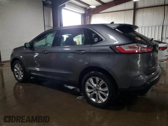 2021 Ford Edge Titanium with VIN 2FMPK4K96MBA38750, listed as a Copart auction lot 61401615 with 34,778 mi miles and Salvage title. Bid and sale history available at DreamBid. Image 2.