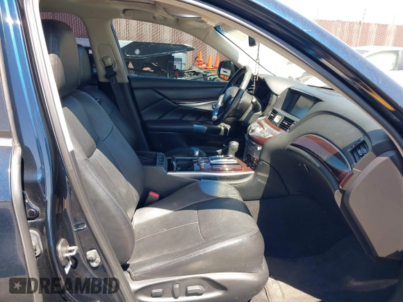 2015 Infiniti Q70 with VIN JN1BY1PP8FM601834, listed as a IAAI auction lot 42028330 with 106,285 mi miles and . Bid and sale history available at DreamBid. Image 5.