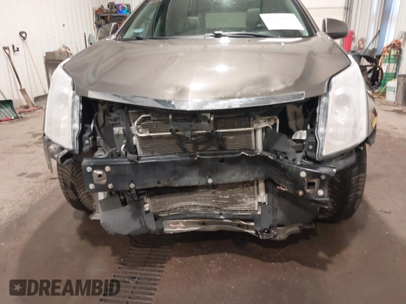 2014 Cadillac SRX Performance Collection z VIN 3GYFNFE38ES578066, wystawiony jako IAAI lot #42153023 z przebiegiem 134 009 mil mil oraz . Historia ofert i sprzedaży dostępna na DreamBid. Obrazek 6.