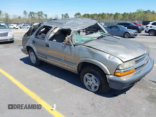 1999 Chevrolet Blazer Trailblazer z VIN 1GNDT13W4X2162282, wystawiony jako IAAI lot #41863705 z przebiegiem 220 358 mil mil oraz . Historia ofert i sprzedaży dostępna na DreamBid. Obrazek 1.