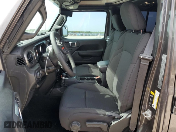 2023 Jeep Wrangler Willys with VIN 1C4HJXDGXPW526093, listed as a Copart auction lot 56818935 with 24,021 mi miles and Salvage title. Bid and sale history available at DreamBid. Image 7.