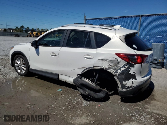 2014 Mazda CX-5 Grand Touring with VIN JM3KE4DY6E0363211, listed as a Copart auction lot 48352315 with 214,298 mi miles and Salvage Title. Bid and sale history available at DreamBid. Image 2.