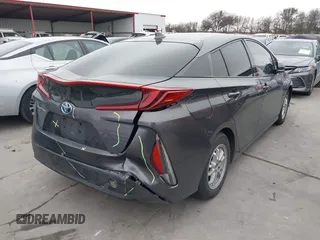 2018 Toyota Prius Plus with VIN JTDKARFPXJ3087064, listed as a IAAI auction lot 41433495 with 118,298 mi miles and . Bid and sale history available at DreamBid. Image 4.