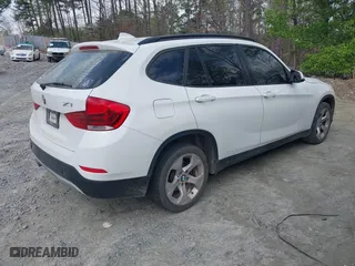 2013 BMW X1 28i with VIN WBAVM1C59DVW44965, listed as a IAAI auction lot 41951047 with 122,191 mi miles. Bid and sale history available at carsss.com. Image 4.