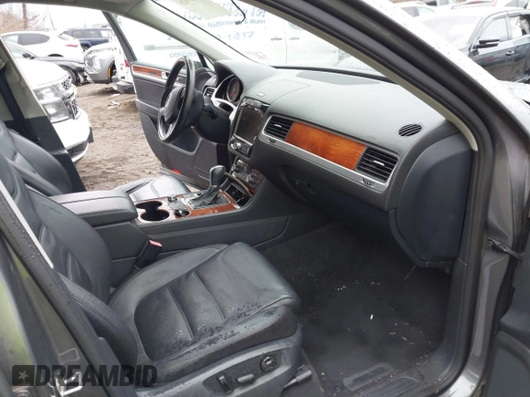 2013 Volkswagen Touareg Lux with VIN WVGEF9BP0DD005082, listed as a IAAI auction lot 41667026 with 140,148 mi miles and . Bid and sale history available at DreamBid. Image 5.