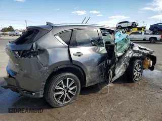 2018 Mazda CX-5 Grand Touring with VIN JM3KFADM1J1426938, listed as a Copart auction lot 50873615 with 83,436 mi miles and Clean Title. Bid and sale history available at carsss.com. Image 3.