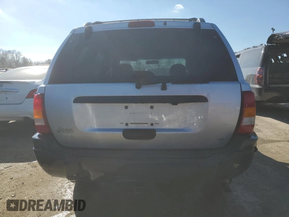 2004 Jeep Grand Cherokee Laredo with VIN 1J4GW48S54C349888, listed as a Copart auction lot 43009574 with 238,247 mi miles and Salvage title. Bid and sale history available at DreamBid. Image 6.