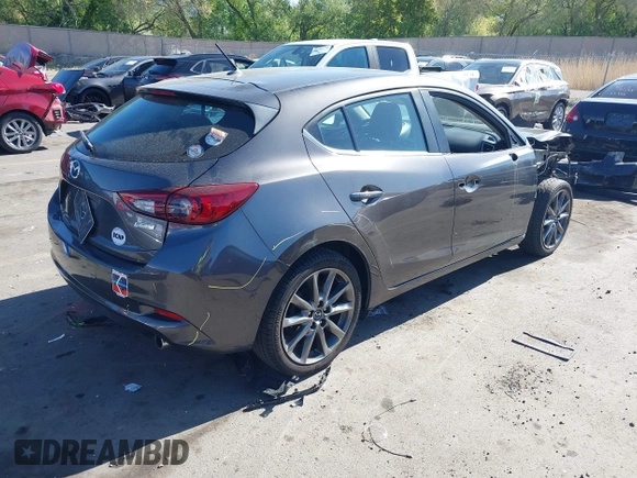 2018 Mazda 3 Touring with VIN 3MZBN1L34JM164952, listed as a IAAI auction lot 42179420 with 106,706 mi miles and . Bid and sale history available at DreamBid. Image 4.