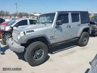 2007 Jeep Wrangler Unlimited X with VIN 1J4GA39197L161975, listed as a IAAI auction lot 41742409 with 270,227 mi miles. Bid and sale history available at carsss.com. Image 20.