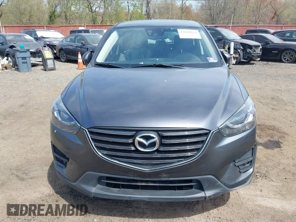 2016 Mazda CX-5 Grand Touring z VIN JM3KE4DY1G0893119, wystawiony jako IAAI lot #42049614 z przebiegiem 102 506 mil mil oraz . Historia ofert i sprzedaży dostępna na DreamBid. Obrazek 12.