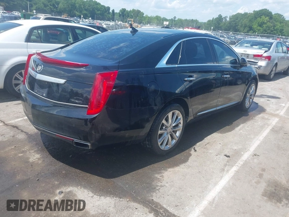 2013 Cadillac XTS Luxury z VIN 2G61P5S37D9101989, wystawiony jako IAAI lot #42242641 z przebiegiem 243 006 mil mil oraz . Historia ofert i sprzedaży dostępna na DreamBid. Obrazek 4.