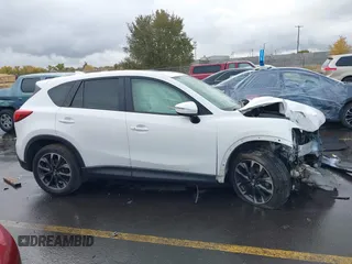 2016 Mazda CX-5 Grand Touring with VIN JM3KE4DY0G0705691, listed as a IAAI auction lot 40880798 with 130,624 mi miles. Bid and sale history available at carsss.com. Image 13.