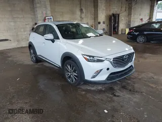 2016 Mazda CX-3 Grand Touring z VIN JM1DKBD71G0126151, wystawiony jako IAAI lot #42215837 z przebiegiem 81 349 mil mil oraz . Historia ofert i sprzedaży dostępna na DreamBid. Obrazek 1.