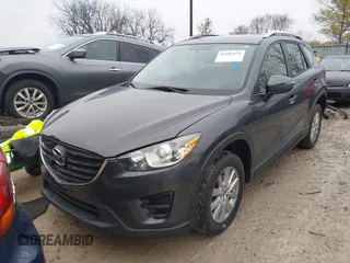 2016 Mazda CX-5 Sport with VIN JM3KE4BY5G0885754, listed as a IAAI auction lot 41103575 with 136,263 mi miles and . Bid and sale history available at carsss.com. Image 2.