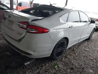 2017 Ford Fusion Hybrid Titanium with VIN 3FA6P0RU1HR322997, listed as a IAAI auction lot 41506630 with 263,589 mi miles and . Bid and sale history available at DreamBid. Image 4.