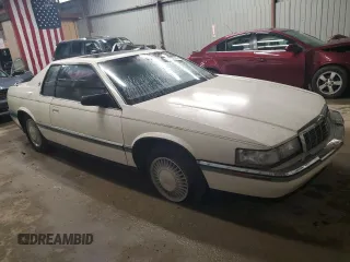 1992 Cadillac Eldorado z VIN 1G6EL13B8NU614555, wystawiony jako Copart lot #73767514 z przebiegiem 88 448 mil mil oraz Tytuł czysty. Historia ofert i sprzedaży dostępna na DreamBid. Obrazek 4.