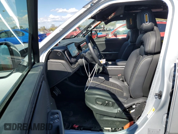 2024 Rivian R1S Adventure with VIN 7PDSGBBA4RN036045, listed as a Copart auction lot 74982414 with 9,256 mi miles and Salvage Title. Bid and sale history available at carsss.com. Image 7.