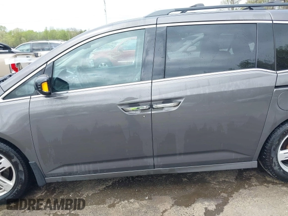 2013 Honda Odyssey Touring with VIN 5FNRL5H94DB013310, listed as a IAAI auction lot 42079565 with 128,622 mi miles and . Bid and sale history available at carsss.com. Image 14.