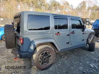 2015 Jeep Wrangler Unlimited Rubicon Hard Rock with VIN 1C4HJWFGXFL671660, listed as a Copart auction lot 82329074 with 214,579 mi miles and Salvage title. Bid and sale history available at DreamBid. Image 3.