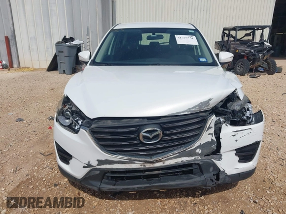 2016 Mazda CX-5 Sport with VIN JM3KE2BYXG0683318, listed as a IAAI auction lot 41777751 with 116,922 mi miles. Bid and sale history available at carsss.com. Image 12.