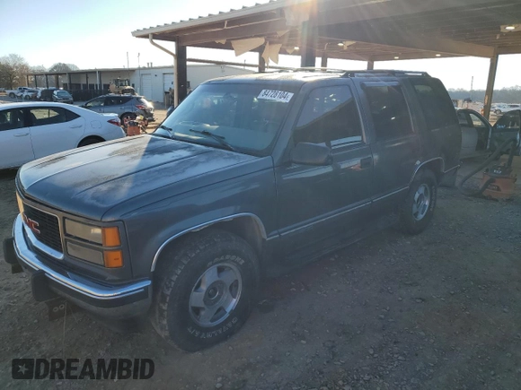 1999 GMC Yukon with VIN 1GKEK13R3XJ750307, listed as a Copart auction lot 84728104 with 212,879 mi miles and Salvage Title. Bid and sale history available at carsss.com. Image 1.