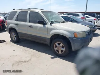 2003 Ford Escape XLS Popular with VIN 1FMYU02103KE20195, listed as a IAAI auction lot 41830663 with 262,580 mi miles. Bid and sale history available at carsss.com. Image 1.