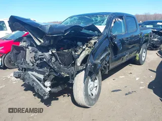 2023 Toyota Tacoma SR with VIN 3TMCZ5AN9PM555191, listed as a IAAI auction lot 41935645 with 31,580 mi miles and . Bid and sale history available at DreamBid. Image 2.