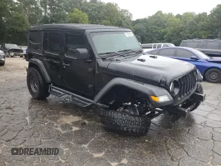 2023 Jeep Wrangler Sport with VIN 1C4HJXDN9PW638737, listed as a Copart auction lot 71367284 with 12,054 mi miles and Salvage Title. Bid and sale history available at DreamBid. Image 4.