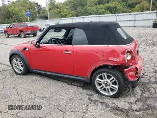2011 MINI Convertible with VIN WMWZN3C51BTZ78331, listed as a Copart auction lot 73348304 with 94,219 mi miles and Salvage title. Bid and sale history available at DreamBid. Image 2.