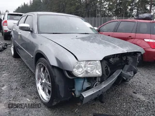 2006 Chrysler 300 C with VIN 2C3KA63H06H286676, listed as a IAAI auction lot 41231230 with 134,565 mi miles. Bid and sale history available at carsss.com. Image 1.