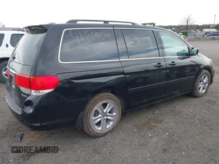 2010 Honda Odyssey Touring with VIN 5FNRL3H95AB040354, listed as a IAAI auction lot 41889501 with 155,069 mi miles. Bid and sale history available at carsss.com. Image 4.