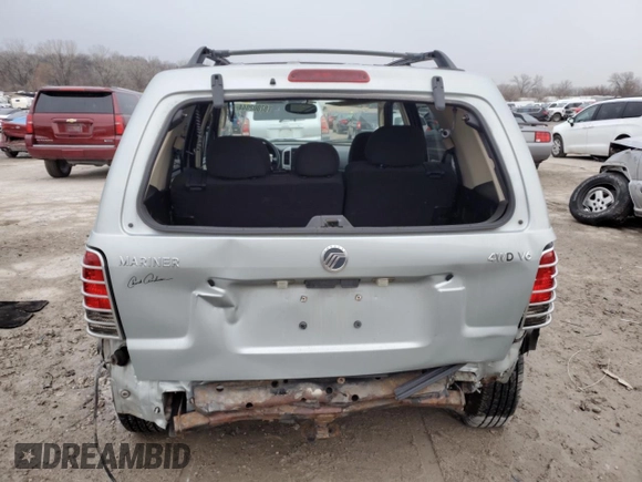 2005 Mercury Mariner Luxury z VIN 4M2CU57105DJ33266, wystawiony jako Copart lot #87002044 z przebiegiem 164 313 mil mil oraz Szkody całkowita. Historia ofert i sprzedaży dostępna na DreamBid. Obrazek 6.